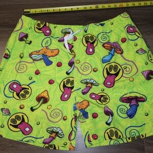 Men's Neon Am I Tripping Shorts featuring a psychedelic mushroom and smiley face